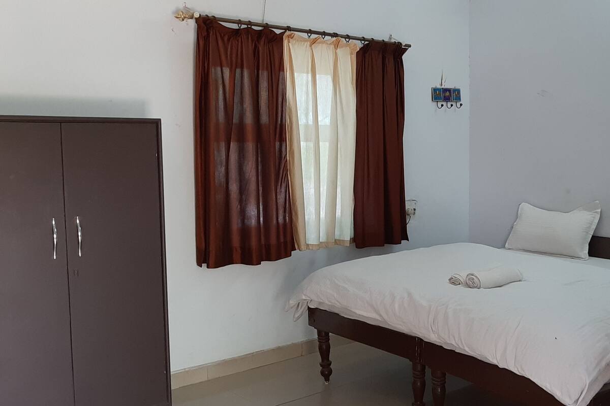 Deluxe Room, Garden View | In-room safe, desk, laptop workspace, soundproofing