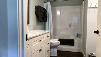 Combined shower/bathtub, hair dryer, towels, soap