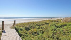 A wooden boardwalk leading to a sandy beach with a clear blue sky. - Golf View, Pool, Pickleball, Stocked kitchen - 52 Fairway Dunes (Isle Of Palms)