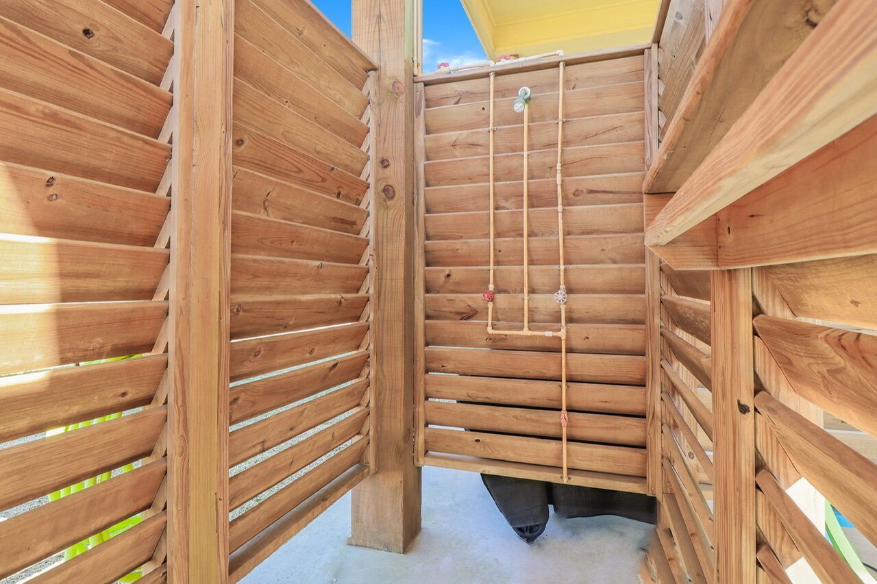 A wooden structure with horizontal slats and a central vertical support.