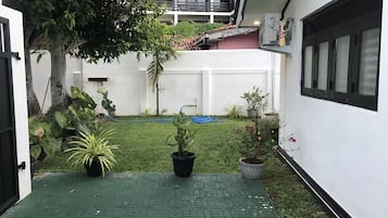 Stroll through the peaceful courtyard, surrounded by lush greenery and a tranquil atmosphere.