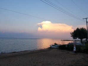 On the beach, sun-loungers, beach towels - Beachfront home cure for high blood pressure (Harbor Beach)