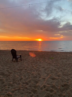 On the beach, sun loungers, beach towels