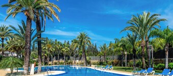 RELISH THIS TOP NOTCH, GENEROUS DUPLEX WITH HEATED POOL IN PRIVATE SOLARIUM