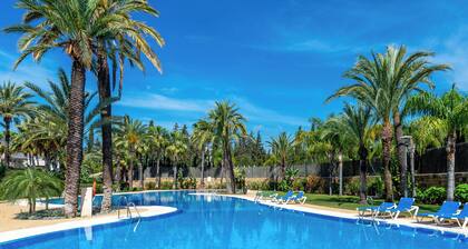 RELISH THIS TOP NOTCH, GENEROUS DUPLEX WITH HEATED POOL IN PRIVATE SOLARIUM