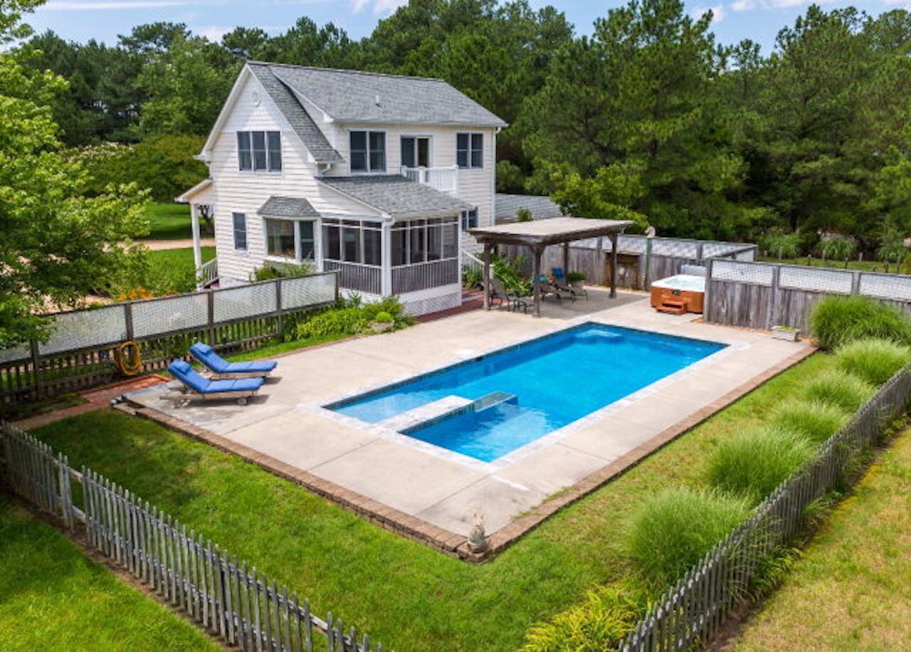 Private, secluded waterfront cottage - pool and hot tub feet from the back door.