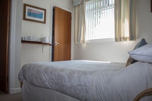 Double Room, Garden View | Iron/ironing board, free WiFi, bed sheets