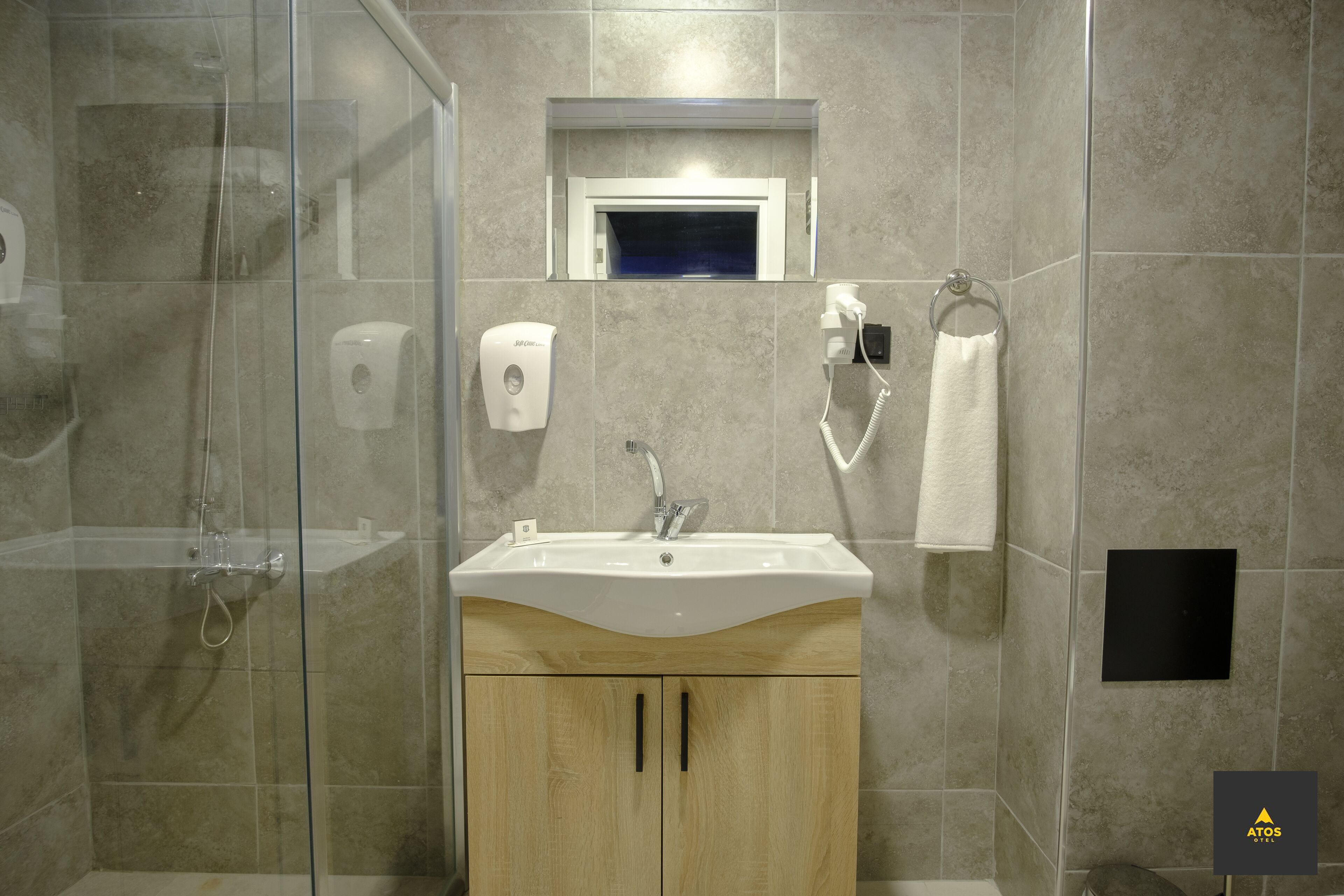 Shower, hair dryer, slippers, towels