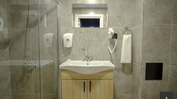 Shower, hair dryer, slippers, towels