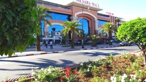 A large shopping mall with a prominent sign reading "MENARA MALL". - Charming little studio in Marrakech 4095 (Marrakech)