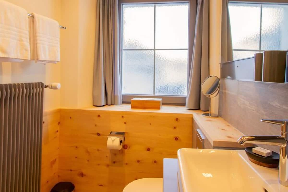 superior double room, mountain view | bathroom | hair dryer, bathrobes, towels