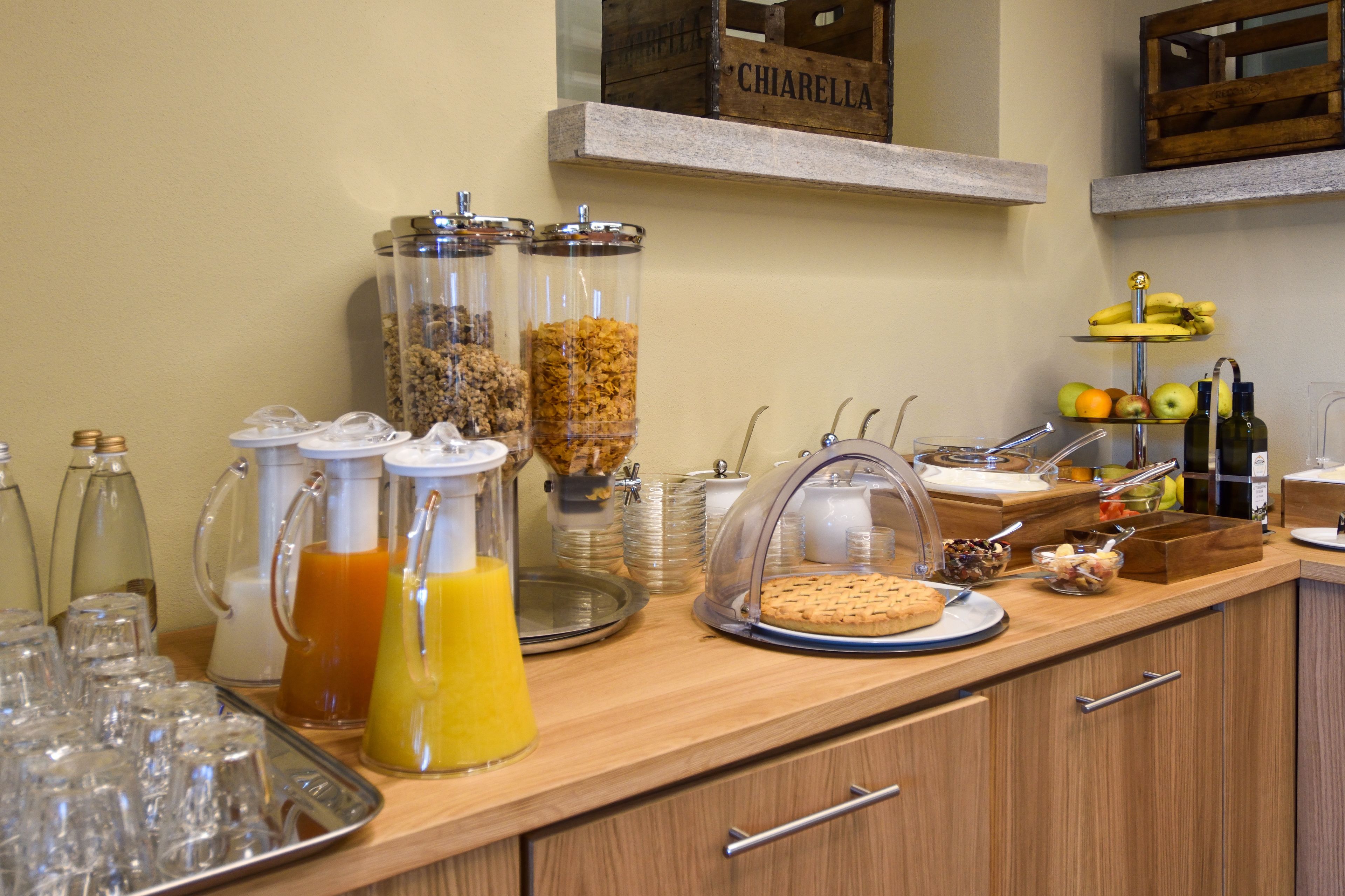 A breakfast buffet with various food items and beverages.