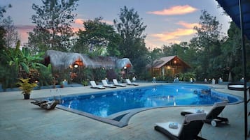 Outdoor pool, open 7:30 AM to 7:00 PM, lifeguards on site