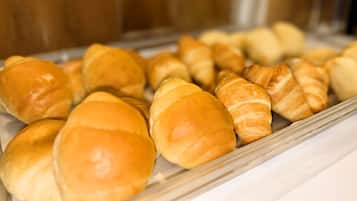 A display case containing various baked goods, likely in a bakery or café setting.