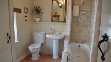 Combined shower/bathtub, hair dryer, towels, soap