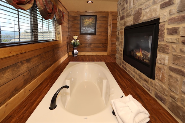 Designer toiletries, hair dryer, towels, toilet paper
