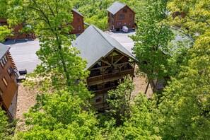 Experience the serene atmosphere of this rustic lodge, surrounded by lush forest and offering panoramic views of the woodland.