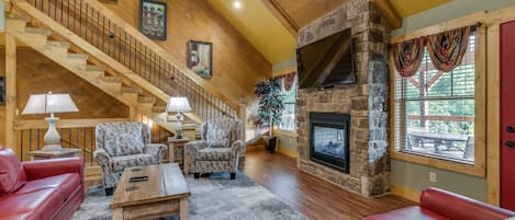 House, Multiple Beds, Hot Tub | Living area | 70-inch flat-screen TV with cable channels, TV, fireplace