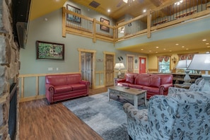 House, Multiple Beds, Hot Tub | Living area | 70-inch flat-screen TV with cable channels, TV, fireplace - Swimmin in the Smokies - Six Bedroom Chalet (Gatlinburg)