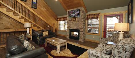 70-inch flat-screen TV with cable channels, TV, fireplace