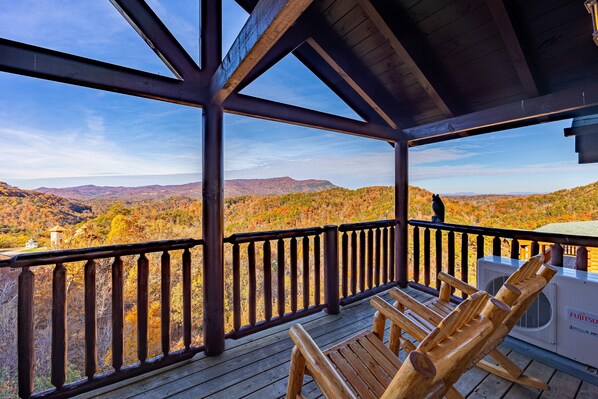 A wooden deck with a view of a mountainous landscape. - Picture Perfect- Seven Bedroom Cabin (Sevierville)