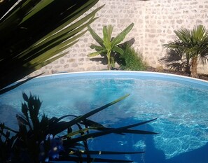 Seasonal outdoor pool, open 9:30 AM to 11:00 PM, pool loungers