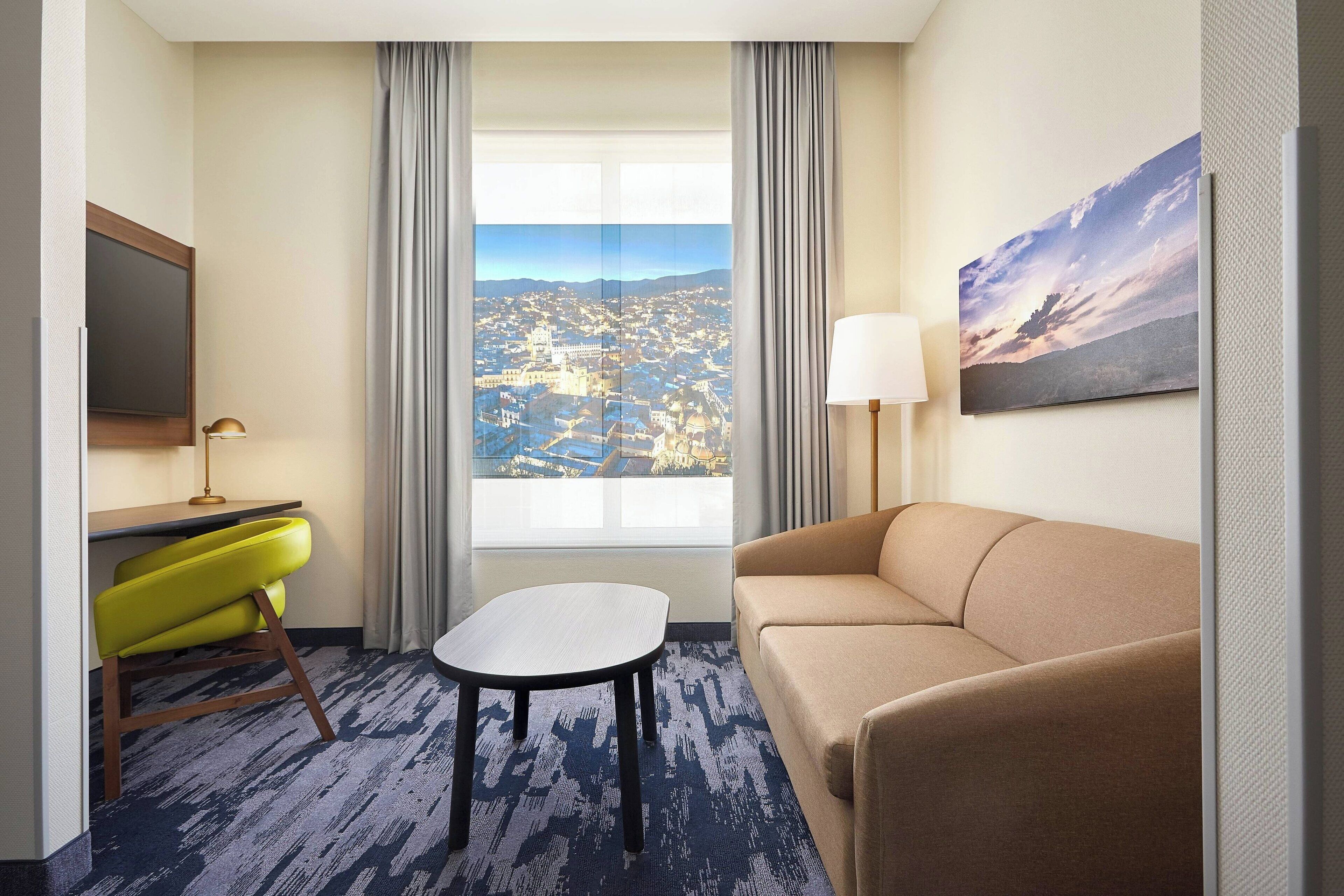 room, 1 king bed with sofa bed, city view | living area | 70-inch flat-screen tv with satellite channels, tv