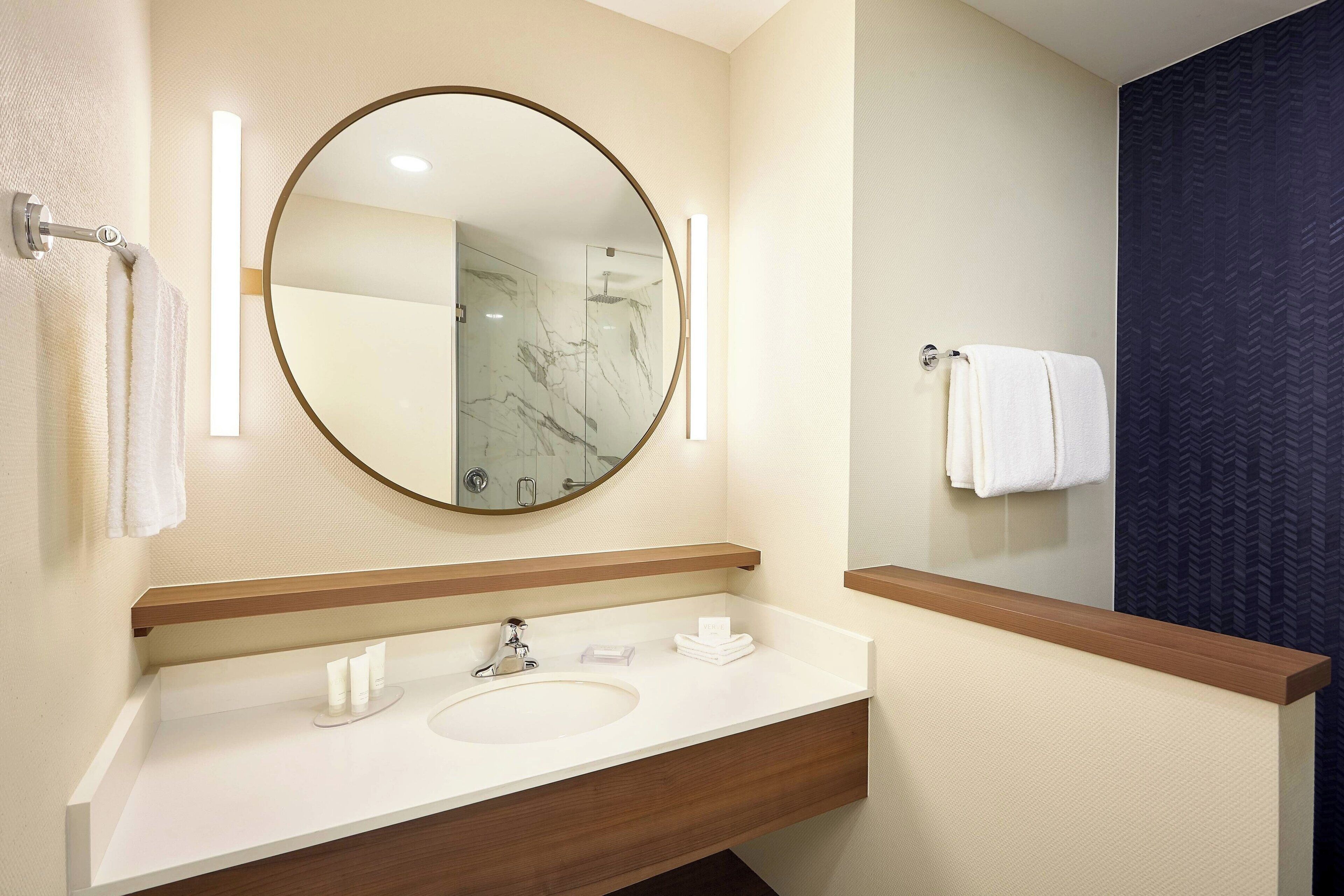 rainfall showerhead, eco-friendly toiletries, hair dryer, towels