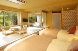 A room with a bed, a small table with chairs, a TV, and large windows with blinds. - HAKONE YUYADO ZEN (Hakone)