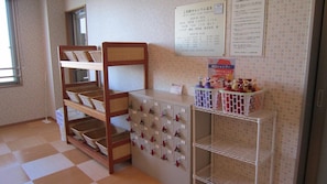 A hotel room with a bunk bed, a minibar, and a bulletin board with notices. - Hotel Mark 1 Tsukuba (Tsukuba)