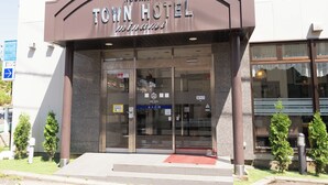 The exterior of the Noshiro Town Hotel with a clear entrance, glass doors, and a red carpet leading to the entrance. - Noshiro Town Hotel Minami (Noshiro)