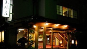 A building with a traditional entrance, a staircase, and a sign with Japanese characters. - Togurakamiyamada Onsen Sanpu So (Chikuma)