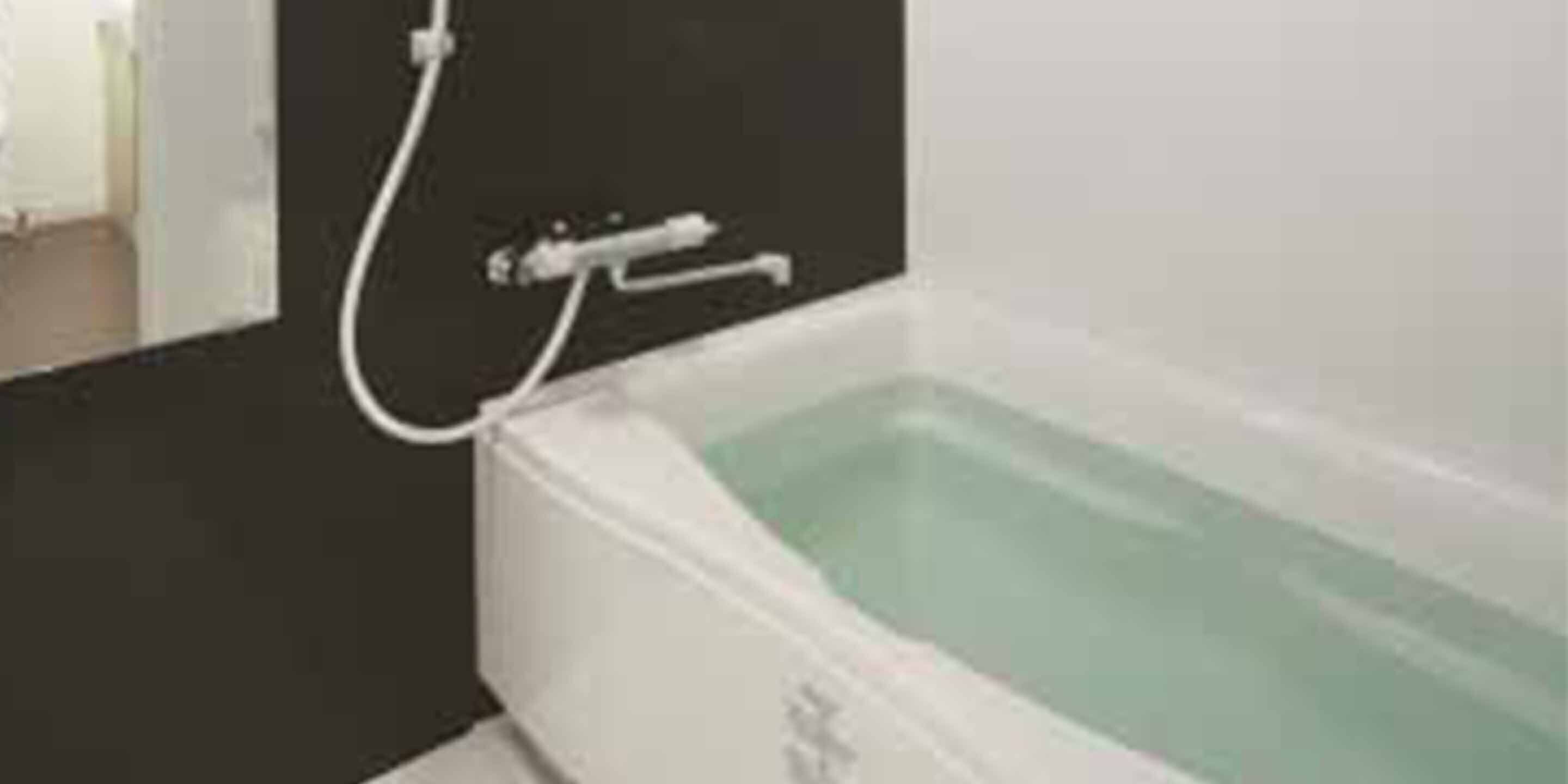 A bathroom with a bathtub, a shower, and a toilet.