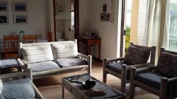 Family Apartment, 3 Bedrooms | Living area | Flat-screen TV