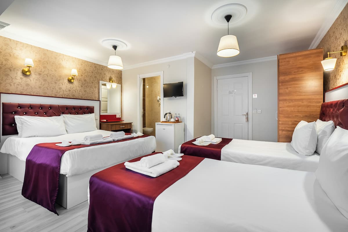 Family Quadruple Room, City View | Premium bedding, minibar, laptop workspace, free WiFi
