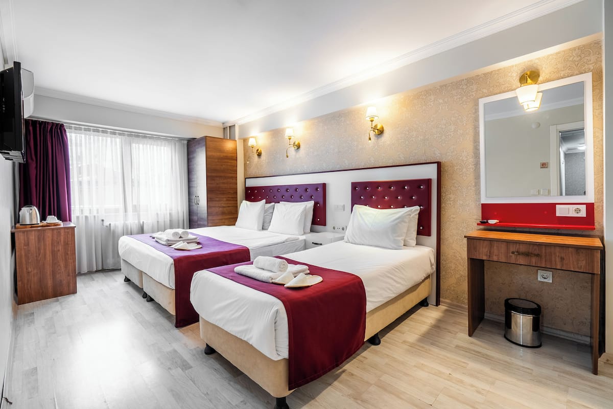 Standard Triple Room, City View | Premium bedding, minibar, laptop workspace, free WiFi