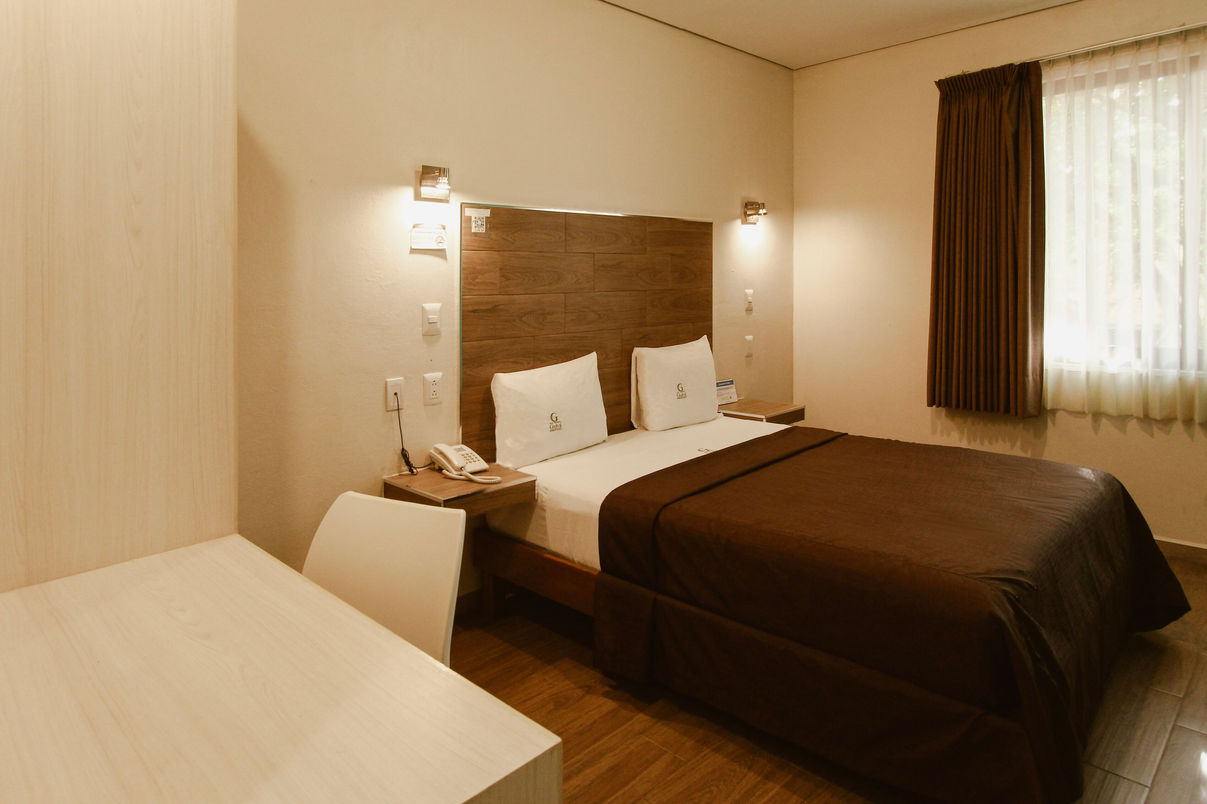 desk, laptop workspace, blackout curtains, iron/ironing board