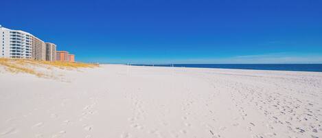Stroll along the soft, white sands with stunning beachfront views and nearby volleyball courts for active fun on the beach