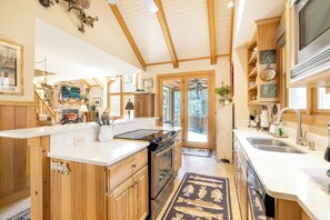 Dishwasher, coffee/tea maker, cookware/dishes/utensils, dining tables