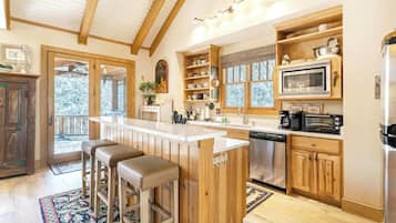 Dishwasher, coffee/tea maker, cookware/dishes/utensils, dining tables