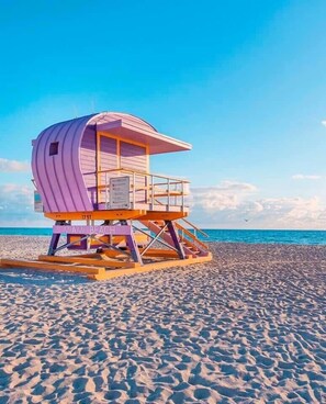 On the beach, sun-loungers, beach towels