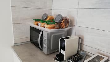 Fridge, microwave, stovetop, coffee/tea maker