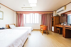 Standard Twin Room | Desk, laptop workspace, blackout drapes, iron/ironing board