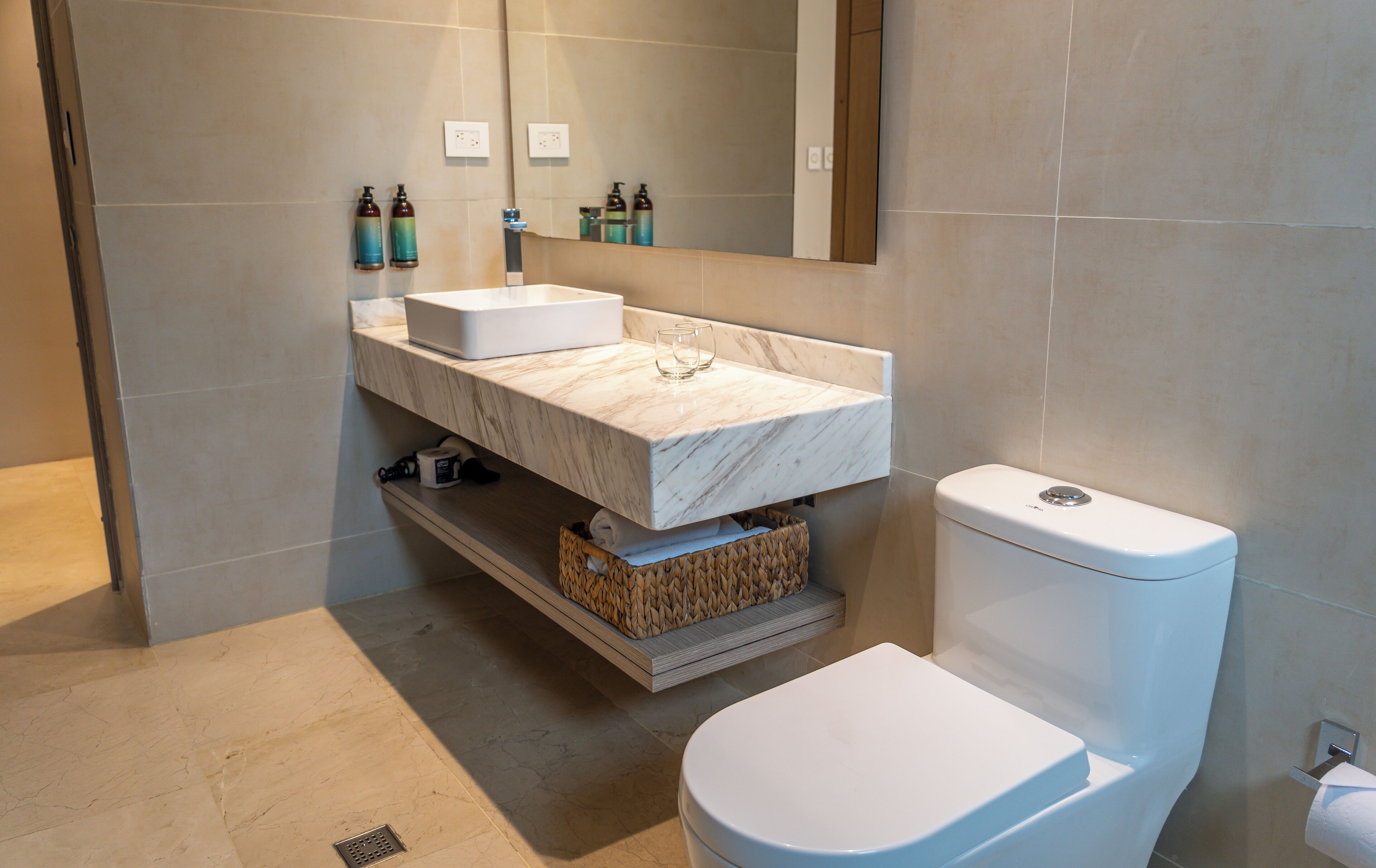 shower, designer toiletries, hair dryer, towels