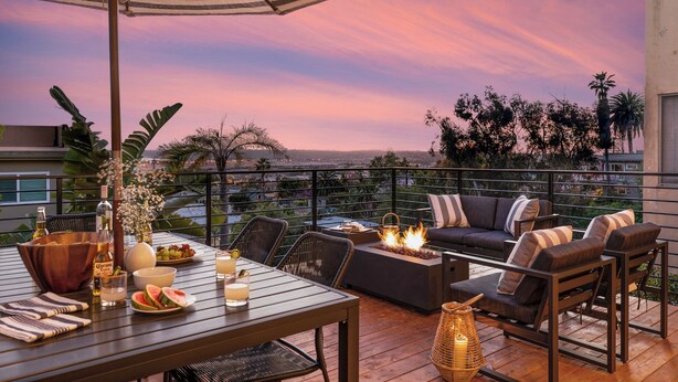 An outdoor patio with a dining table, chairs, a sofa, and a fire pit. - Avalon 2 Unit Buyout (I & III) AvantStay | Mins to Gaslamp| Beautiful Deck w/BBQ (San Diego)