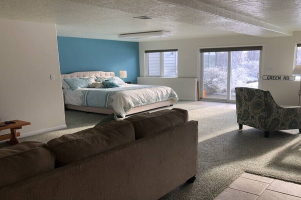 Living area with a view to the bedroom area to the right.