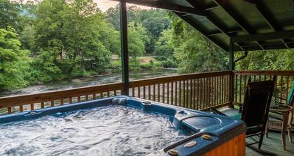 Cottage on the Tuckasegee River with firepit, picnic area, hot tub, & AC