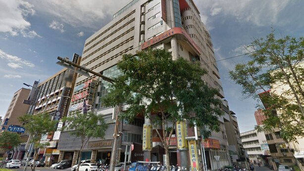 A multi-story commercial building with various signs and storefronts. - Hsinchu World Trade Business Hall (Hsinchu)