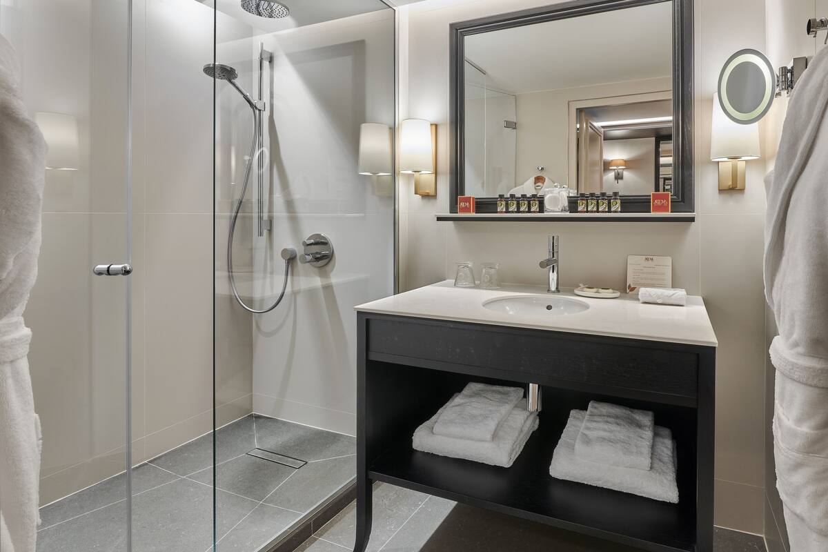 hair dryer, bathrobes, slippers, towels