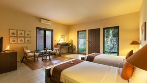 A hotel room with two beds, a desk, a chair, and a view of the outdoors. - 3 Bedroom Balinese Style Villa, Lovely Villa Close to Shopping Area Seminyak (Seminyak)